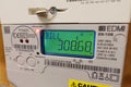 Electric meter showing the current high bill. Cost of living.