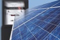 Electric meter with solar panel against blue background, close up. Royalty Free Stock Photo