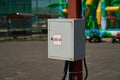 Electric meter 380 V. Gray box on a pole. Street electricity. Royalty Free Stock Photo