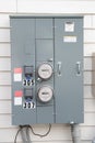 Electric Meters For Apartments are located on the wall outside the building. Close-up Royalty Free Stock Photo