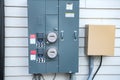 Electric Meters For Apartments are located on the wall outside the building. Close-up Royalty Free Stock Photo