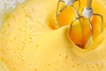 Electric Mixer Beaters Beating Eggs Royalty Free Stock Photo