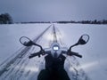 Electric mobility scooter on the road during the winter season in the snow. Lithuania Royalty Free Stock Photo