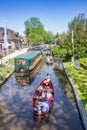 Electric motorboats with tourists in the central canal of Giethoorn