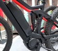 Electric mountain bike or e bicycle. Details of motor, battery and suspension shock absorber.