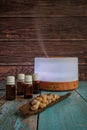 Electric oil diffuser with bottles and frankincense, vertical format