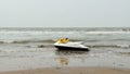 Electric personal watercraft vehicle for Jet skiing Water sports enthusiast in an empty sea beach. Jet skiing is sport racing over Royalty Free Stock Photo