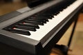 Playing the piano, close-up on the hand and keyboard
