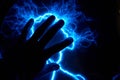 Electric plasma ball on a dark background. Static electricity model Royalty Free Stock Photo