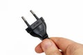 Electric plug being held in a hand Royalty Free Stock Photo