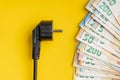 Electric plug and euro money. Concept of the increasing electricity prices Royalty Free Stock Photo