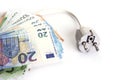 Electric plug with euro money on the white. Energy save concept. Royalty Free Stock Photo