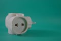 electric plug on green background