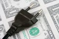 Electric plug and money Royalty Free Stock Photo