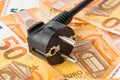 Electric plug on money euro