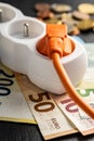 Electric plug, socket and euro money. Concept of increasing electric prices Royalty Free Stock Photo