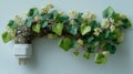 Electric plug that transforms into a blossoming vine. The image symbolizes renewable energy and harmony between nature and Royalty Free Stock Photo