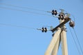 Electric pole against blue clear sky. Royalty Free Stock Photo