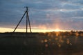 electric pole on the background of sunset in spring Royalty Free Stock Photo