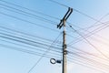 The electric pole with black wire cable and clear blue sky. Royalty Free Stock Photo