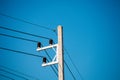 Electric pole and cable blue sky