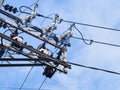 Electric pole with electric transformers and electrical cables Royalty Free Stock Photo