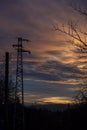 Electric pole in a field during the sunset Royalty Free Stock Photo