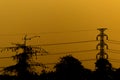 Electric pole high voltage silhouette and evening time