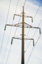 Electric pole with high-voltage wires against the blue sky Royalty Free Stock Photo