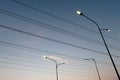 Electric pole with LED lighting. The light is emitting at dusk Royalty Free Stock Photo