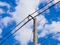 Electric pole power lines and wires with blue sky. Royalty Free Stock Photo