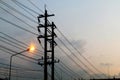 Electric pole power Tangle wire danger, wire electrical energy and light at street road on sky background evening