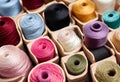 Colorful Yarn vibrant array of thread spools in wooden containers. AI Generated Royalty Free Stock Photo