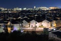 Electric Poles Over Dense Houses in Quiet Residential Suburb at Night Royalty Free Stock Photo