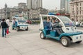 2 electric police vehicles on boardwalk along Bund, Shanghai, China