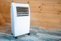 Electric portable heater in a wooden house in cold winter creates a comfortable climate and coziness but consumes a lot of Royalty Free Stock Photo