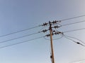 A electric post connected electric lines with blue sky background.