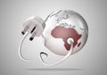 Electric power cable and plug point connect to a brightly colored Africa on a world globe Royalty Free Stock Photo