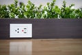 Electric power outlet socket with built in USB chargers on the table between seats for charging students` mobile phones or Royalty Free Stock Photo