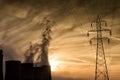 Electric power plant at dusk with orange sky in Kozani Greece Royalty Free Stock Photo