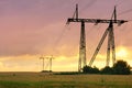 Electric power pylons at sunset Royalty Free Stock Photo