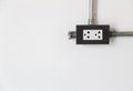 Electric power socket on white wall Royalty Free Stock Photo
