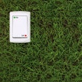 Electric power switch on a green grass background Royalty Free Stock Photo