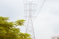 Electric Power Transmission Lines over trees and residential are Royalty Free Stock Photo