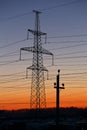 Electric power transmission lines at sunset. Royalty Free Stock Photo