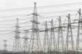 Electric power transmissions high voltage tower on fog sky background