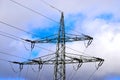 electric pylon with blue sky and white clouds Royalty Free Stock Photo