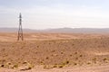 Electric pylon in desert Royalty Free Stock Photo