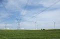 Electric pylons close to windturbines Royalty Free Stock Photo