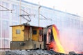 The electric rail system and pouring liquid copper slag of the casting in the construction site. Casting is a manufacturing proces Royalty Free Stock Photo